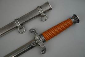 A close up of a sword

Description automatically generated