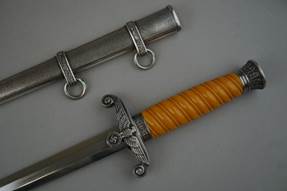 A picture containing weapon, knife, sword

Description automatically generated