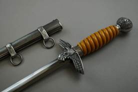 A picture containing weapon, wall, indoor, knife

Description automatically generated