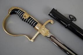 A sword and a black handle

Description automatically generated with medium confidence