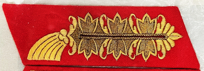 A red and gold embroidered rectangular object

AI-generated content may be incorrect.