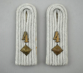 A pair of white rope straps with gold numbers

Description automatically generated