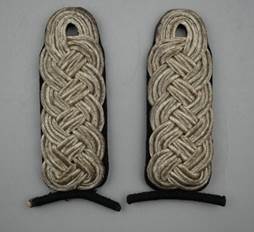 A pair of braided straps

Description automatically generated