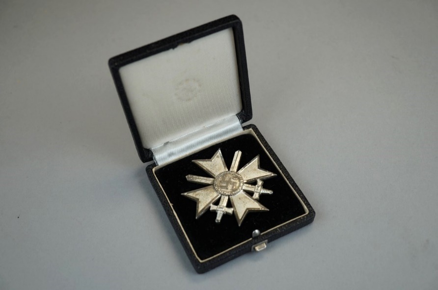 A close-up of a badge

Description automatically generated