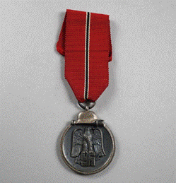 A close-up of a medal

Description automatically generated