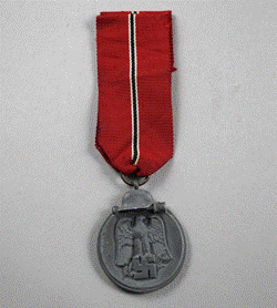 A close-up of a medal

Description automatically generated