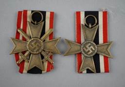 A close-up of two medals

Description automatically generated