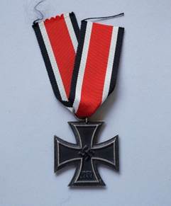 A close-up of a medal

Description automatically generated with low confidence