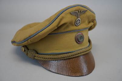 A yellow hat with a brown band

Description automatically generated