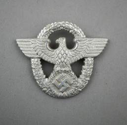 A silver eagle with a swastika

Description automatically generated