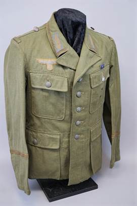 A green military uniform

Description automatically generated with low confidence