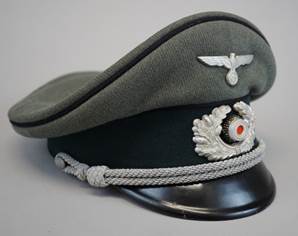 A military hat with a silver emblem

Description automatically generated
