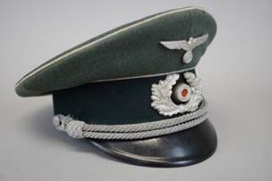 A green hat with silver accents

Description automatically generated