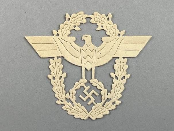 A white eagle with a swastika and a swastika on a gray background

AI-generated content may be incorrect.