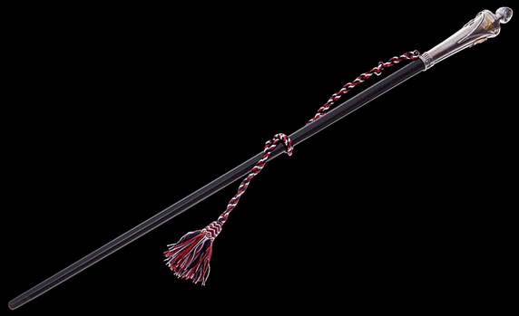 A black stick with red and white tassel

Description automatically generated